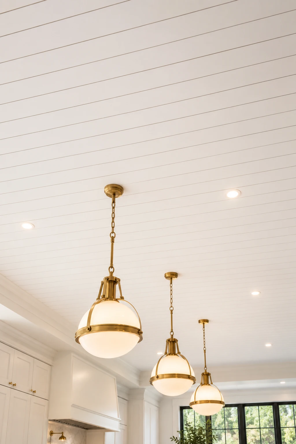 Minimal white shiplap kitchen ceiling with brass globe pendant lights, evenly spaced recessed lighting, smooth painted ceiling planks, bright luxury kitchen design, elegant transitional ceiling, clean architectural finish, modern farmhouse kitchen inspiration, timeless white ceiling decor, sophisticated shiplap ceiling with hanging brass fixtures