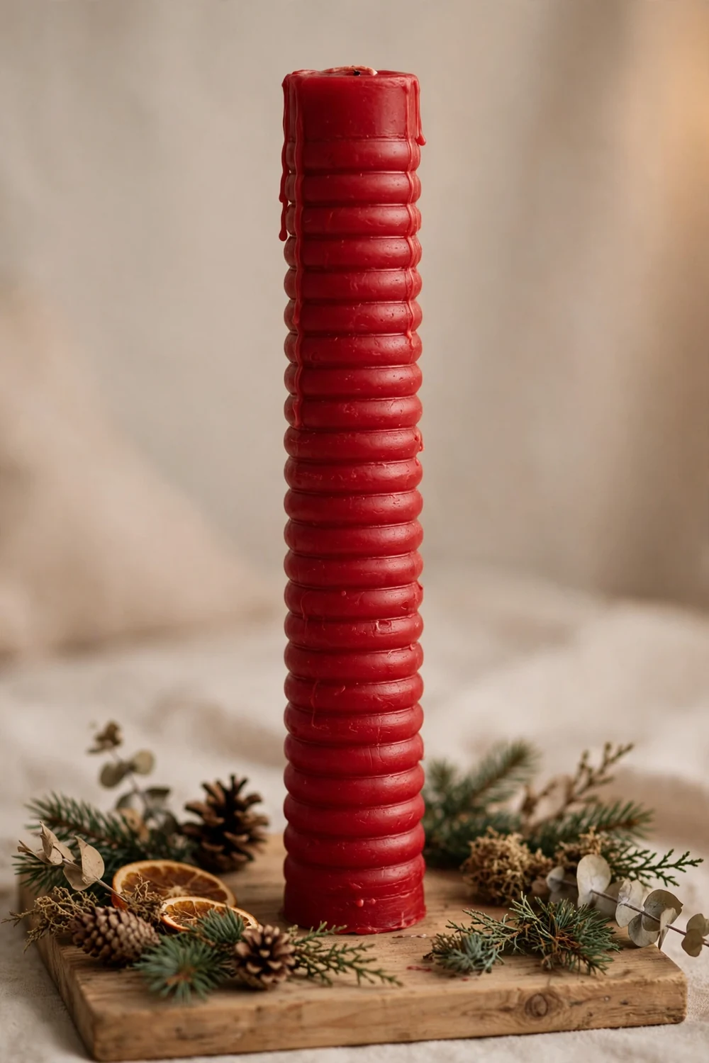 Wooden advent candle marked in days Red advent candle marked in days on a wooden board, a Nordic Christmas ritual